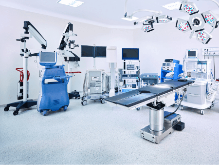 A large operating room with many medical equipment.