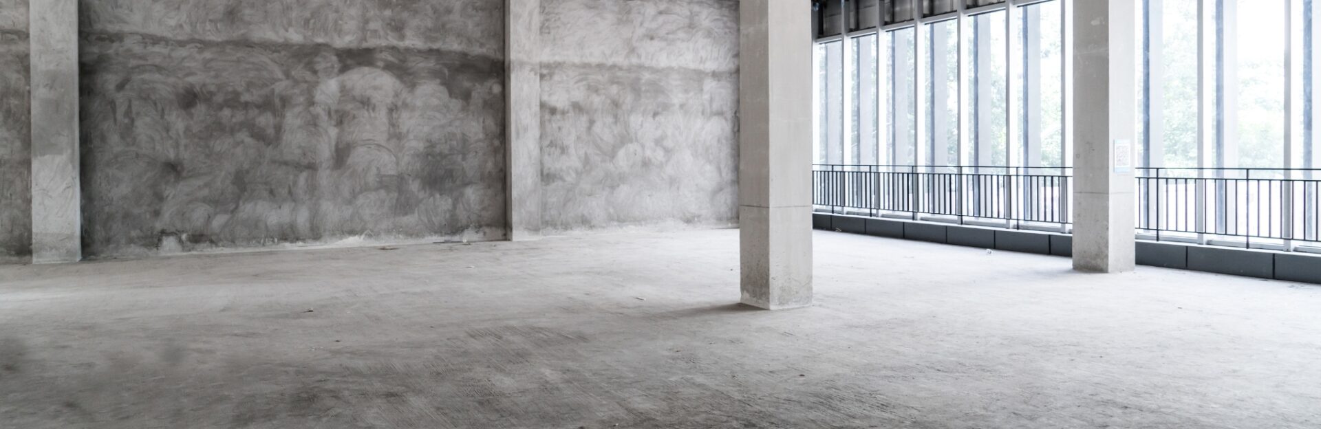 A room with concrete floors and walls.