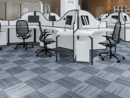 A room with many cubicles and chairs in it